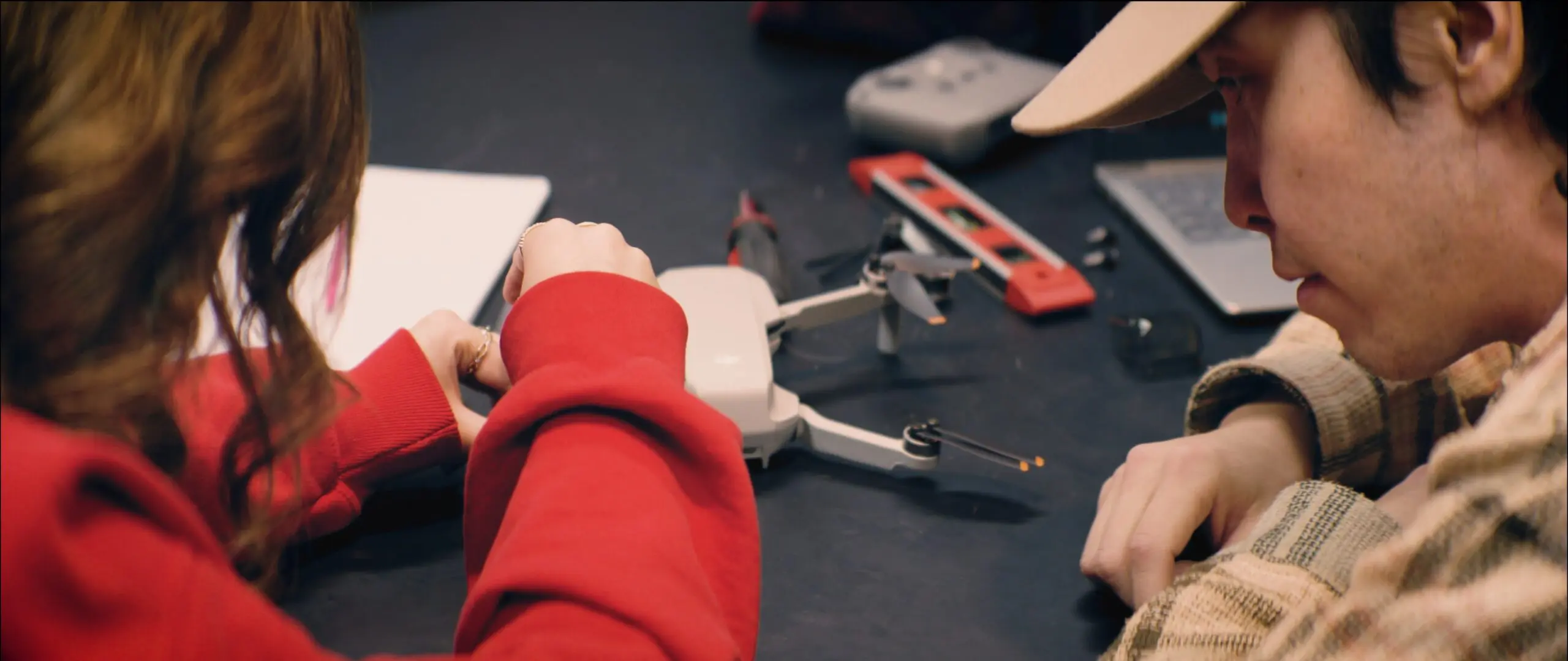 Honors College scholars assembling a drone in a lab