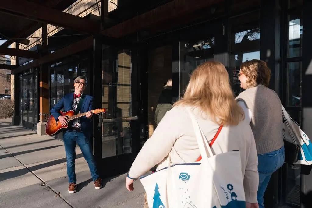 James Bergman performing music outside WellTold 2025