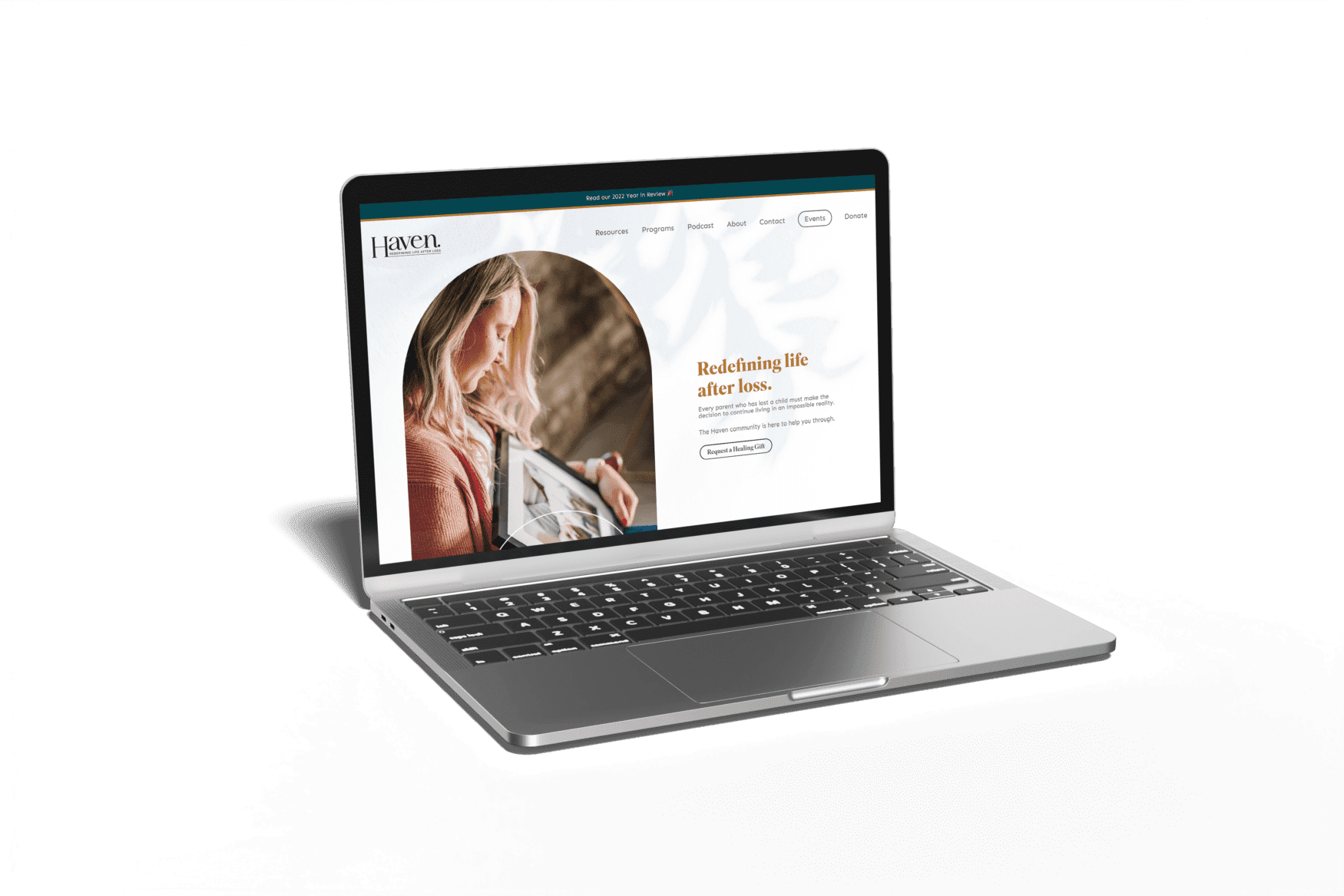 Mockup showing a laptop with the screen displaying the website of Haven: Redefining Life After Loss.