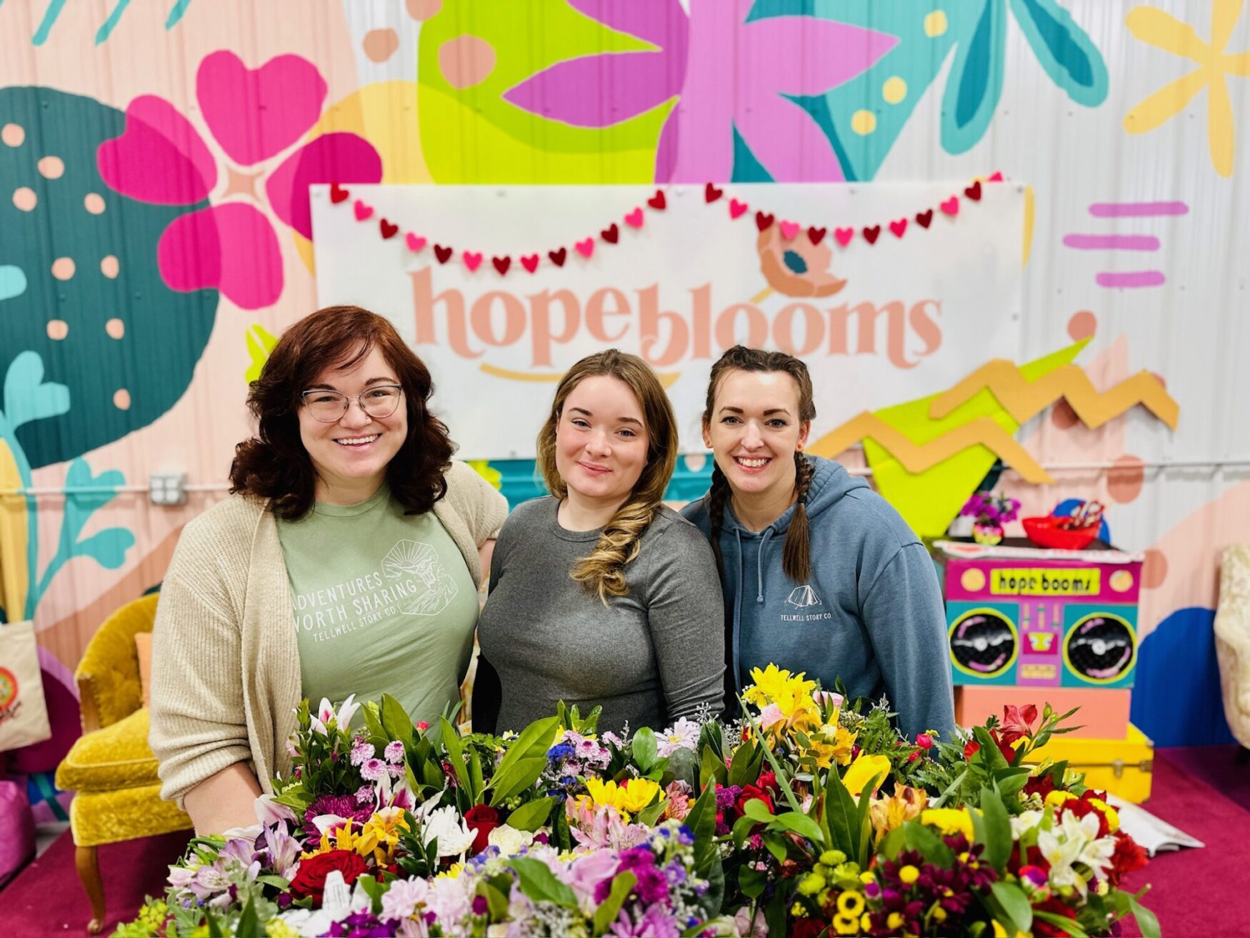 KJ, Emma, and Sandie volunteering at Hope Blooms