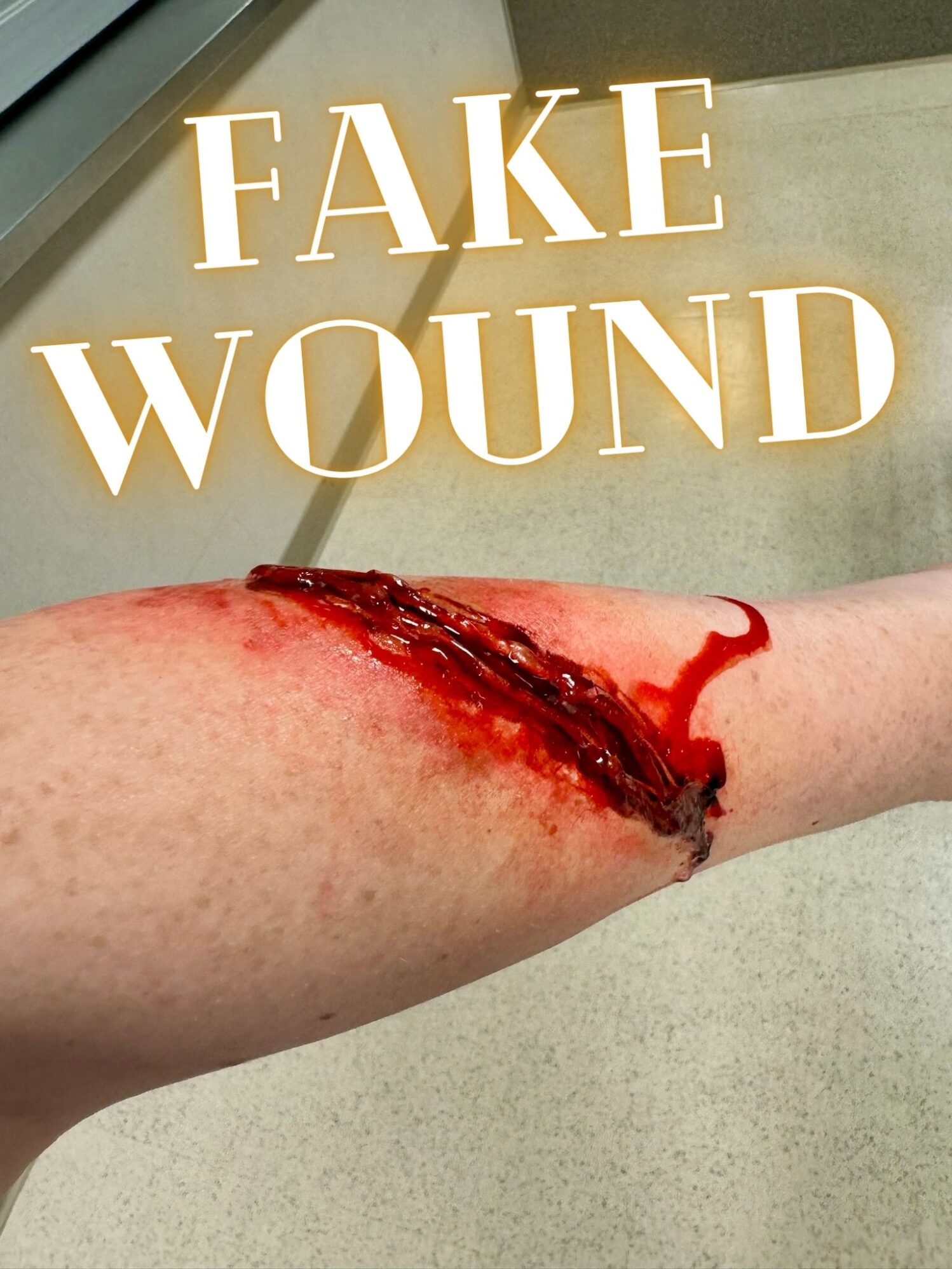 A view of Emma's stage wound. Text identifies it as a fake wound.