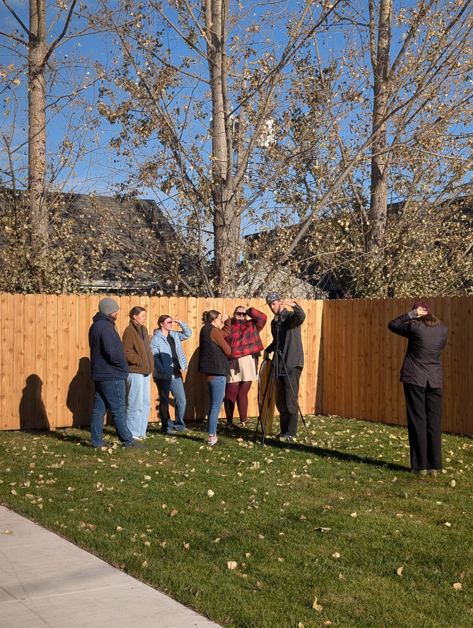 A couple FARRMS staff and Duncan talk about filming in harsh sunlight in the Tellwell backyard.
